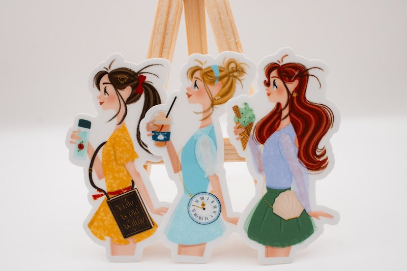 Die-cut Cinderella sticker for iPhone and two other stickers that reimagine the Disney princesses as regular park guests.